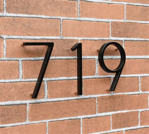 custom house numbers metal black floating on brick wall|building numbers on brick.